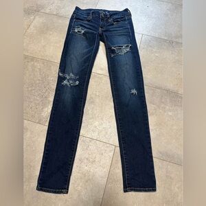 American Eagle “super stretch” distressed jeggings size 00